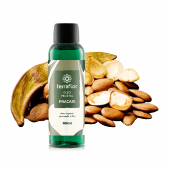 Frasco do óleo vegetal de pracaxi com sementes ao fundo.